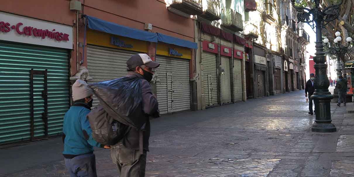 HOY, comercios de Puebla BAJARÁN CORTINAS para evitar destrozos de feministas